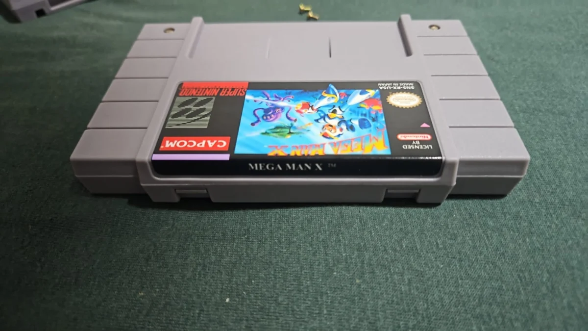 CX/ L*o B**to /MEGAMAN X! EM PORTUGUÊS BR! SNES. 57,00 SEGUIDOS DE 9,00