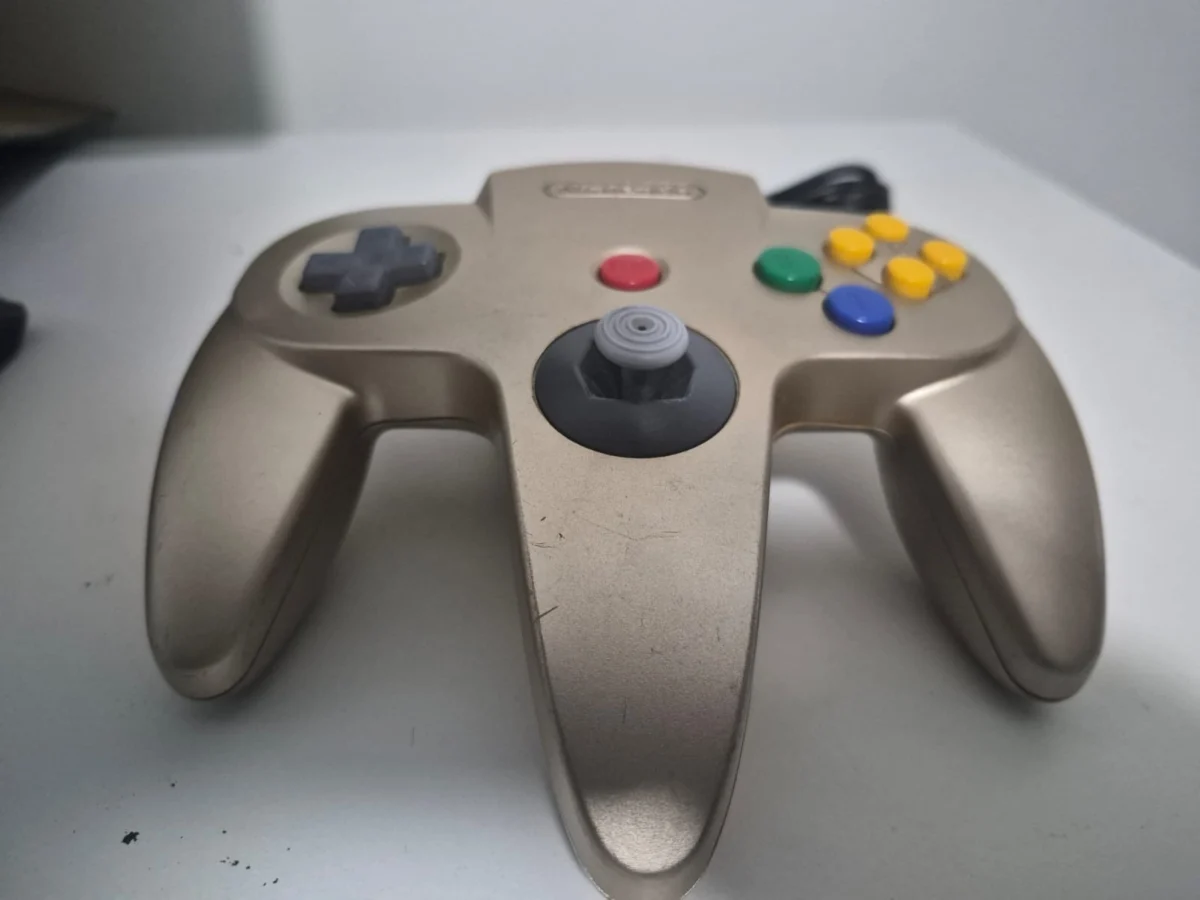 JD/ ORIGINAL CONTROLE N64 GOLD, 209,00 SEGUIDOS DE 11,00