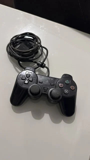 NR/ ORIGINAL CONTROLE PS2 48,00 SEGUIDOS DE 10,00