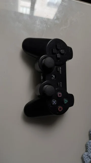 NR/ PAR DE CONTROLES PS3 26,00 SEGUIDOS DE 6,00