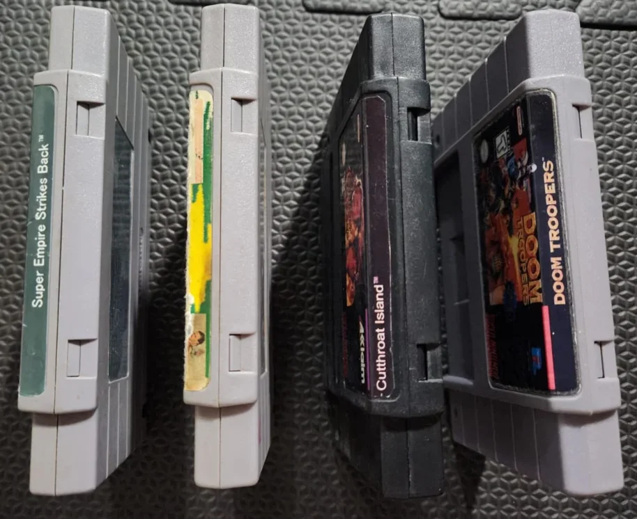 DN/ D***el /LOTE COM 4 JOGOS DE SNES 53,00 SEGUIDOS DE 7,00