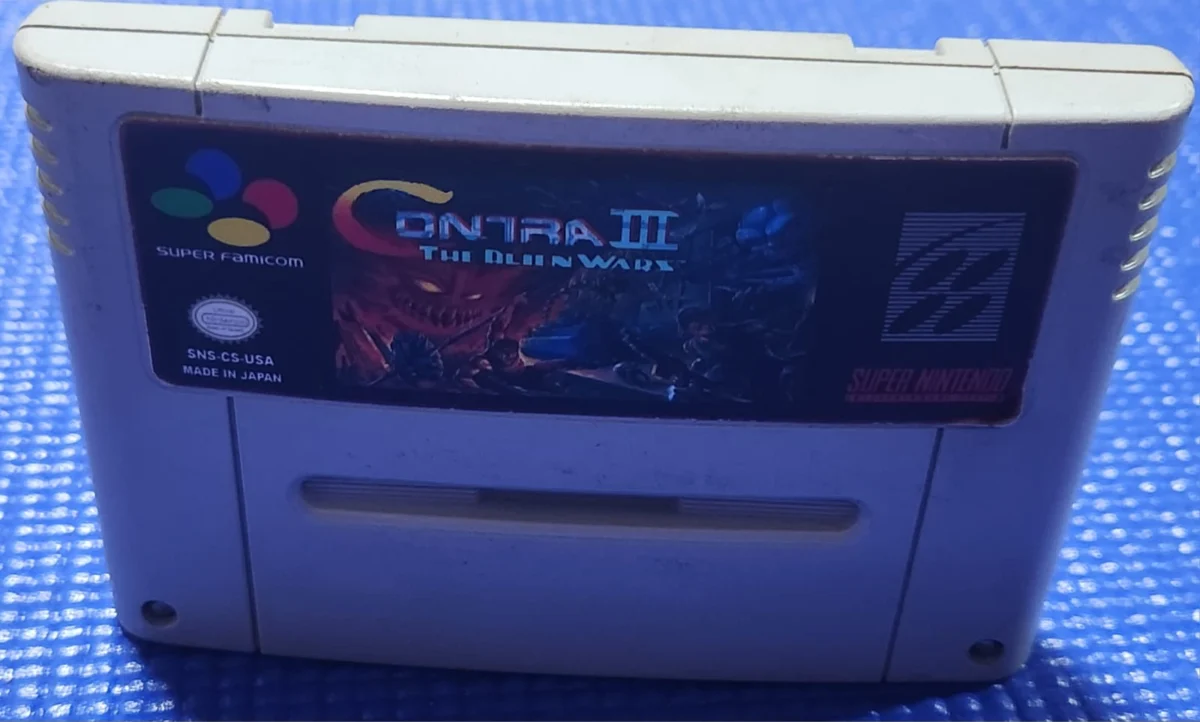 DN/ Q*eu /ORIGINAL CONTRA III SNES 83,00 SEGUIDOS DE 9,00